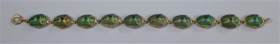 A gilt metal and scarab beetle set bracelet, 19.5cm.